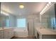 Bright bathroom with double vanity, soaking tub, and glass shower enclosure at 3930 Griffin Ave, Lady Lake, FL 32159