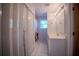 Bright bathroom features a white vanity, tile flooring, and a window for natural light at 3930 Griffin Ave, Lady Lake, FL 32159