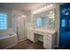 Well-lit bathroom with tub, shower, and dual sink vanity at 3930 Griffin Ave, Lady Lake, FL 32159