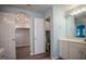Bathroom with a connected water closet and walk-in closet at 3930 Griffin Ave, Lady Lake, FL 32159