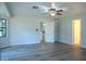 Bright bedroom with a ceiling fan and hard surface floors at 3930 Griffin Ave, Lady Lake, FL 32159