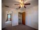 Comfortable bedroom featuring neutral carpet, a ceiling fan, closet, and an additional room or closet offering ample space at 3930 Griffin Ave, Lady Lake, FL 32159