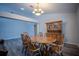 Dining room with classic wooden furniture and an elegant chandelier at 3930 Griffin Ave, Lady Lake, FL 32159