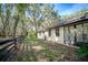 Exterior view of a home featuring a wooden fence line and lush foliage in the yard at 3930 Griffin Ave, Lady Lake, FL 32159