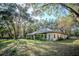 The lush landscaping surrounding this property creates a peaceful, secluded haven with mature trees at 3930 Griffin Ave, Lady Lake, FL 32159