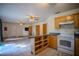Kitchen with breakfast bar flows to the living area at 3930 Griffin Ave, Lady Lake, FL 32159