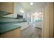 Bright kitchen with white cabinets, laminate countertops, and stainless steel appliances at 3930 Griffin Ave, Lady Lake, FL 32159