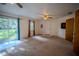 Inviting living room features an open floor plan, and access to the backyard through sliding glass doors at 3930 Griffin Ave, Lady Lake, FL 32159