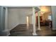 Open floor plan with elegant columns separating the living and dining areas at 3930 Griffin Ave, Lady Lake, FL 32159