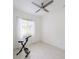 Bright bedroom with a ceiling fan, wood floors, and natural light through the window at 3969 Derby Glen Dr, Clermont, FL 34711