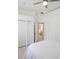 Bedroom with canopy bed and view into bathroom at 3969 Derby Glen Dr, Clermont, FL 34711