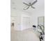 White exercise room featuring wood floors and closet for plenty of storage at 3969 Derby Glen Dr, Clermont, FL 34711