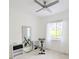 White exercise room, with ceiling fan, wood floors, and a bright window at 3969 Derby Glen Dr, Clermont, FL 34711