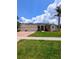 Charming single-story home with three-car garage and a well manicured lawn at 3969 Derby Glen Dr, Clermont, FL 34711