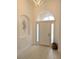 Bright foyer with transom window and decorative niches at 3969 Derby Glen Dr, Clermont, FL 34711