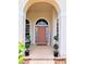 Inviting front entrance with stylish decor and lush greenery at 3969 Derby Glen Dr, Clermont, FL 34711
