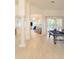 Open game room with neutral tile flooring and a view of the pool at 3969 Derby Glen Dr, Clermont, FL 34711