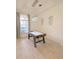 Bright game room featuring a modern light fixture and an air hockey table with wood trim at 3969 Derby Glen Dr, Clermont, FL 34711