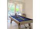 Game room featuring a pool table and sliding glass doors leading to the patio at 3969 Derby Glen Dr, Clermont, FL 34711