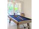 Game room featuring a pool table and sliding glass doors leading to the patio at 3969 Derby Glen Dr, Clermont, FL 34711