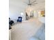 Expansive living area featuring an open floor plan, neutral decor, tile floors, and abundant natural light at 3969 Derby Glen Dr, Clermont, FL 34711