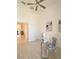 Home office featuring a modern desk, chair, tile floors, and a view to the outside at 3969 Derby Glen Dr, Clermont, FL 34711