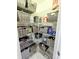 Organized pantry with wire shelving and wicker baskets filled with various food items at 3969 Derby Glen Dr, Clermont, FL 34711