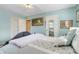 Bedroom featuring a comfortable bed and neutral walls at 410 E Gulley Ave, Oakland, FL 34760