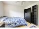 Bedroom featuring neutral walls, tile floors, and dresser with a TV on top at 410 E Gulley Ave, Oakland, FL 34760