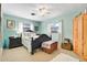 Bright bedroom with natural light, neutral walls, and carpet floor at 410 E Gulley Ave, Oakland, FL 34760
