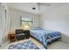 Bedroom featuring a comfortable bed and natural light from exterior window at 410 E Gulley Ave, Oakland, FL 34760