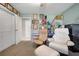 Bonus room featuring two accent chairs and extra storage at 410 E Gulley Ave, Oakland, FL 34760