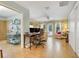 Open living area with tile floors, comfortable seating, and access to an adjacent bathroom at 410 E Gulley Ave, Oakland, FL 34760