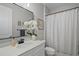 Bright bathroom with modern finishes, a stylish mirror and a shower/tub combo at 440 Bellissimo Pl, Howey In The Hills, FL 34737