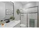 Clean bathroom with white tile, glass shower, and modern fixtures at 440 Bellissimo Pl, Howey In The Hills, FL 34737