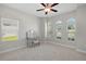 Bright bedroom with a vanity and three arched windows providing ample natural light at 440 Bellissimo Pl, Howey In The Hills, FL 34737