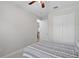 Bright bedroom with large closet and neutral colored walls at 440 Bellissimo Pl, Howey In The Hills, FL 34737