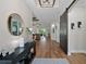 Spacious foyer featuring wood floors, tray ceilings, a barn door, and an open view into the living areas at 440 Bellissimo Pl, Howey In The Hills, FL 34737