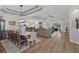 Expansive great room with an open-concept design connecting the dining area, kitchen, and living spaces at 440 Bellissimo Pl, Howey In The Hills, FL 34737