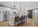 Modern kitchen features stainless steel appliances, granite countertops, and a large center island with seating at 440 Bellissimo Pl, Howey In The Hills, FL 34737