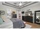 Comfortable main bedroom with tray ceilings, and lots of natural light at 440 Bellissimo Pl, Howey In The Hills, FL 34737