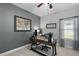 This home office features neutral tones and natural light from the window at 440 Bellissimo Pl, Howey In The Hills, FL 34737