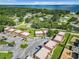A lush aerial view of a residential community with tree-lined streets near the water at 500 Newell Hill Rd # 113D, Leesburg, FL 34748