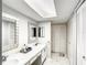 Bathroom with double sinks, marble countertop, and ample storage cabinets at 500 Newell Hill Rd # 113D, Leesburg, FL 34748