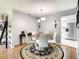 Charming dining area with modern lighting, stylish decor, and a view into the kitchen at 500 Newell Hill Rd # 113D, Leesburg, FL 34748