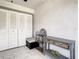 Neutral hallway featuring double closet and a decorative shelving unit at 500 Newell Hill Rd # 113D, Leesburg, FL 34748