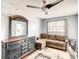 Comfortable living room with a cozy couch, stylish dresser, and lots of natural light at 500 Newell Hill Rd # 113D, Leesburg, FL 34748