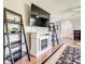 Living room with modern shelving, a fireplace, and sleek decor, creating a cozy ambiance at 500 Newell Hill Rd # 113D, Leesburg, FL 34748