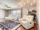 Inviting living room with modern furniture, a large window, and stylish decor at 500 Newell Hill Rd # 113D, Leesburg, FL 34748