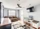 Inviting living room offering a comfortable couch, desk, and plenty of natural light at 500 Newell Hill Rd # 113D, Leesburg, FL 34748
